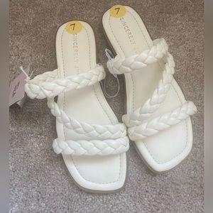 Brand New. Size 7 white sandals